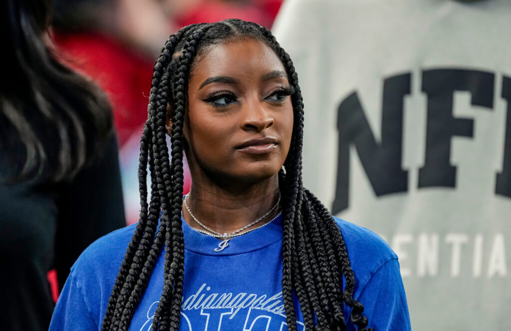 Simone Biles, wife of Indianapolis Colts safety Jonathan Owens (38), walks on the sideline on Saturday, Aug. 29, 2026, ahead of the game against the Detroit Lions.