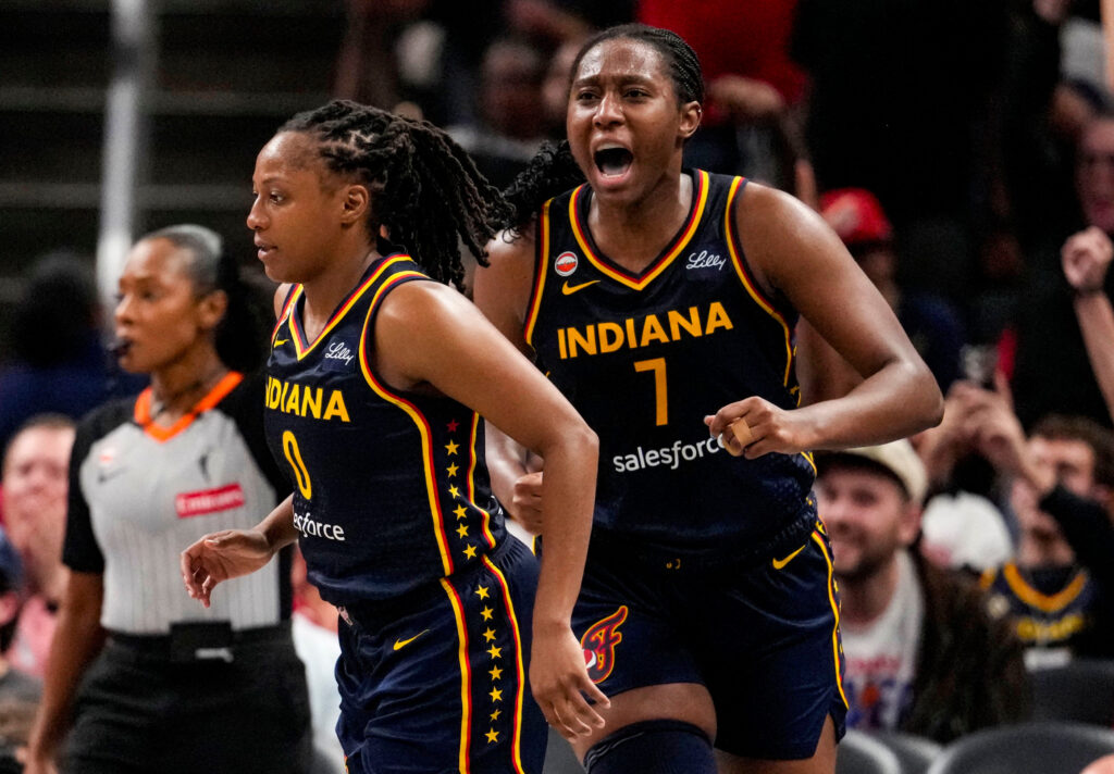 Indiana Fever center Aliyah Boston (7) yells in excitement after Indiana Fever guard Kelsey Mitchell (0) scores a three-point basket on Tuesday, Sept. 22, 2026, during the game at Gainbridge Fieldhouse in Indianapolis.