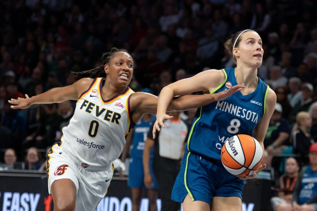 Sep 24, 2026; Minneapolis, Minnesota, USA; Minnesota Lynx forward Antonia Delaere (8) drives to the basket past Indiana Fever guard Kelsey Mitchell (0) in the first half at Target Center.