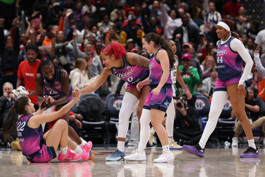 Washington Mystics guard Sonia Citron (22) celebrates with Mystics center Shakira Austin (0) after making a three point field goal while being fouled against the Chicago Sky during the second half at Capital One Arena.