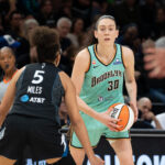 New York Liberty forward Breanna Stewart (30) holds the ball and looks over Minnesota Lynx guard Olivia Miles (5) in the second half during game one of the first round for the 2026 WNBA Playoffs at Target Center.