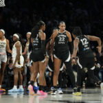 Las Vegas Aces center A'ja Wilson (22) celebrates with teammates after scoring against the Indiana Fever during the third quarter of game one of the first round for the 2026 WNBA Playoffs at Michelob Ultra Arena.