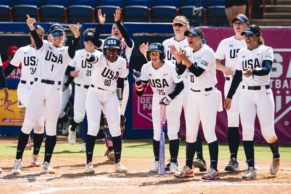USA Softball cheers at home plate during WBSC World Cup in Oklahoma City.