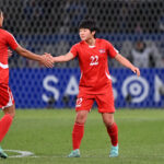 Kim Hye Yong (R) of North Korea celebrates with teammate Wi Jong Sim (L) after scoring the team's first goal during the Women's Football Paris Olympic Asian Final Qualifier second leg between Japan and North Korea at National Stadium on February 28, 2024 in Tokyo, Japan.