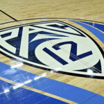 A Pac-12 tournament logo is shown on the court before a semifinal game.