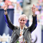 Megan Rapinoe waves to the crowd at her jersey retirement ceremony before the game between the Seattle Reign and the North Carolina Courage at Lumen Field.