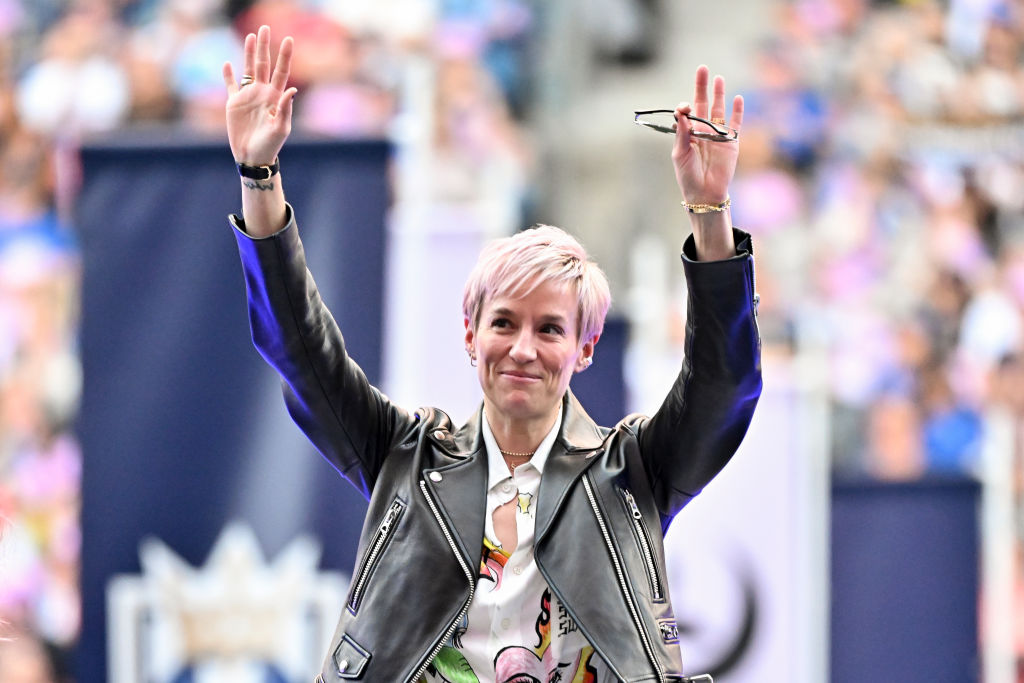 Megan Rapinoe waves to the crowd at her jersey retirement ceremony before the game between the Seattle Reign and the North Carolina Courage at Lumen Field.