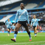 Khadija Shaw of Manchester City celebrates scoring her team's second goal during the Barclays Women's Super League match between Manchester City and Manchester United.