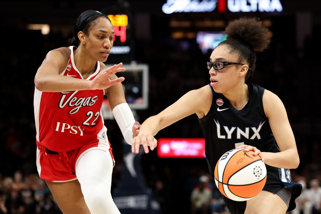 Olivia Miles #5 of the Minnesota Lynx works around A'ja Wilson #22 of the Las Vegas Aces during the second half at Target Center.
