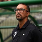 Seb Hines, Head Coach of Orlando Pride, looks on prior to the NWSL match between Portland Thorns FC and Orlando Pride at Providence Park.