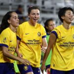 Paige Cronin #4 of Utah Royals celebrates scoring the team's second goal with teammates during the NWSL match between Orlando Pride and Utah Royals at Inter&Co Stadium.