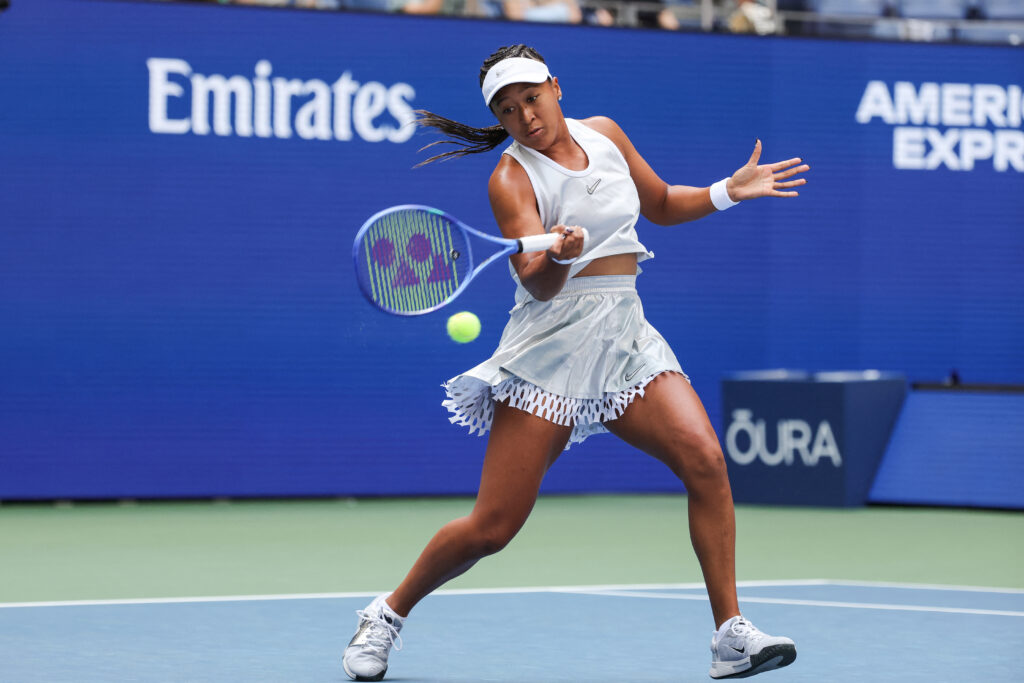 Japan's Naomi Osaka hits a return to Czech Republic's Katerina Siniakova during their women's singles second round tennis match on day five of the US Open tennis tournament at the USTA Billie Jean King National Tennis Center in New York City.