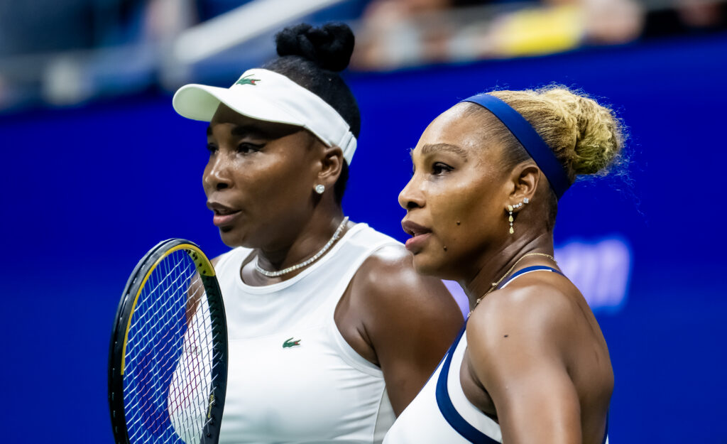 Serena Williams of the United States and Venus Williams of the United States in action against Hao-Ching Chan of Chinese Taipeh and Maya Joint of Australia in the first round of doubles on Day 6 of the US Open at USTA Billie Jean King National Tennis Center.