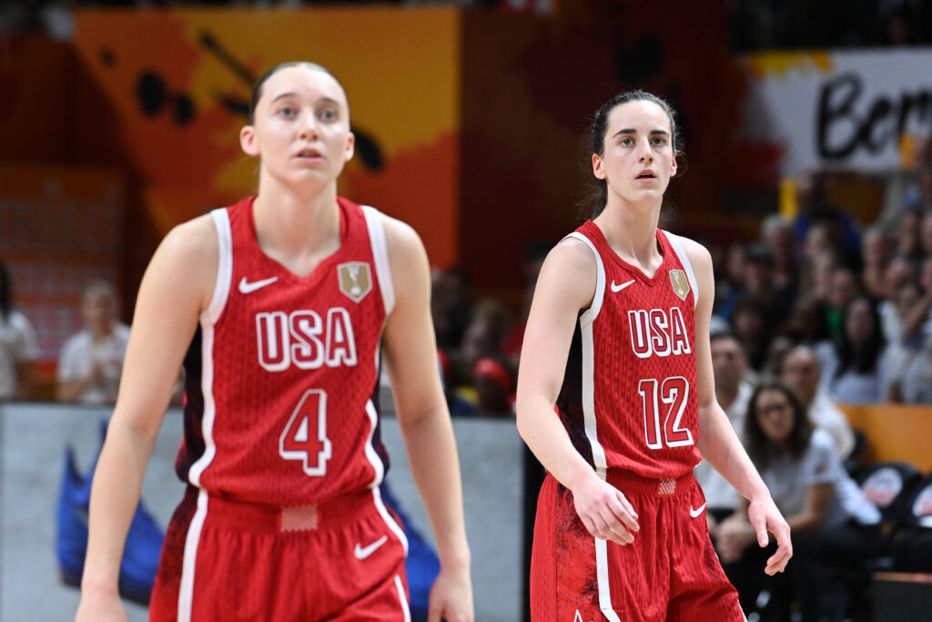 Paige Bueckers #4 and Caitlin Clark #12 of the USA Basketball Women's National Team look on during the game against the Italy Women's National Team during the 2026 FIBA World Cup Qualifying Tournament.