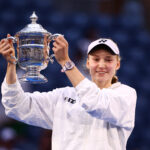 Kazakhstan's Elena Rybakina holds up the winner's trophy after winning the women's singles final tennis match against Belarus's Aryna Sabalenka on day fourteen of the US Open tennis tournament.