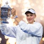 Elena Rybakina of Kazakhstan poses with the champions trophy after defeating Aryna Sabalenka in the women's singles final at the 2026 US Open.