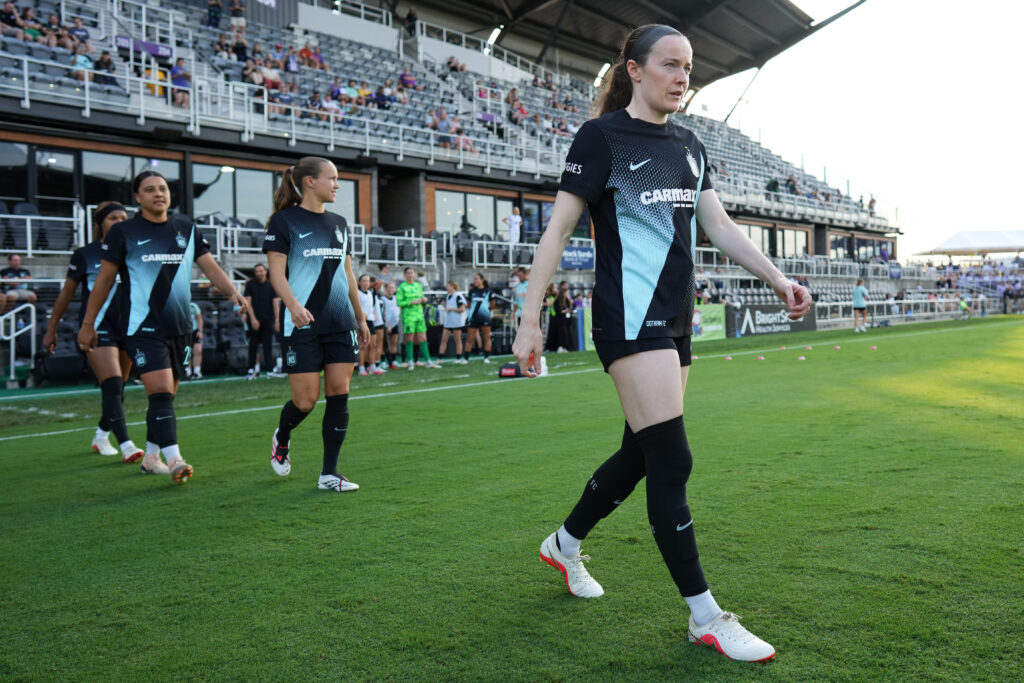 Rose Lavelle #16 of NJ/NY Gotham FC enters the pitch prior to the NWSL match between Racing Louisville FC and NJ/NY Gotham FC at Lynn Family Stadium.