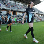 Rose Lavelle #16 of NJ/NY Gotham FC enters the pitch prior to the NWSL match between Racing Louisville FC and NJ/NY Gotham FC at Lynn Family Stadium.