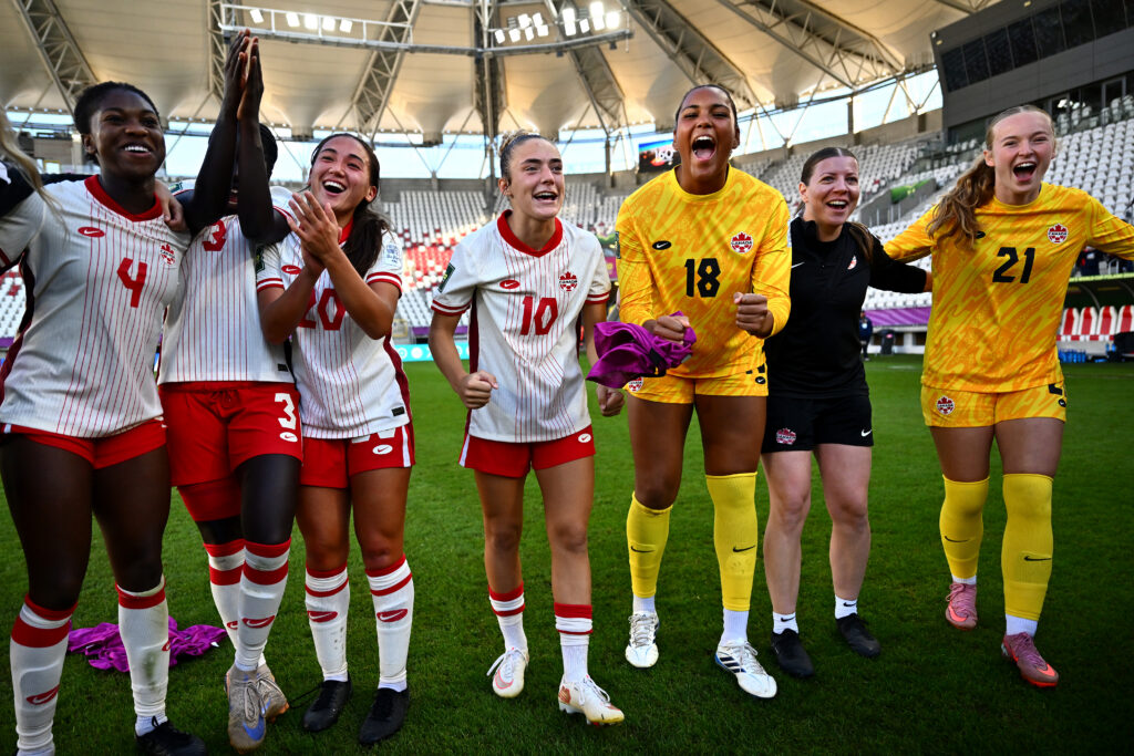 Canada players celebrate after the FIFA U-20 Women's World Cup Round of 16 match between France and Canada at Stadion Miejski LKS Lodz.