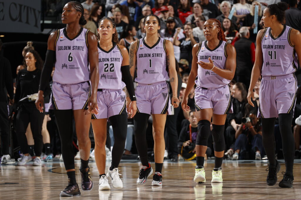 Kaila Charles #6, Veronica Burton #22, Gabby Williams #1, Kayla Thornton #5, and Kiah Stokes #41 of the Golden State Valkyries look on during the game against the Portland Fire.