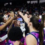 Washington Mystics players celebrate after the game against the Connecticut Sun at CareFirst Arena on September 22, 2026 in Washington, DC.