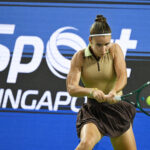 Russia's Tatiana Prozorova hits a return against Philippines' Alexandra Eala during the WTA Singapore Open Tennis round of 16 in Singapore.