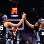 Allisha Gray #15 and Jordin Canada #3 of the Atlanta Dream high five during the game against the Washington Mystics during Round One Game One of the 2026 WNBA Playoffs on September 27, 2026 at State Farm Arena.
