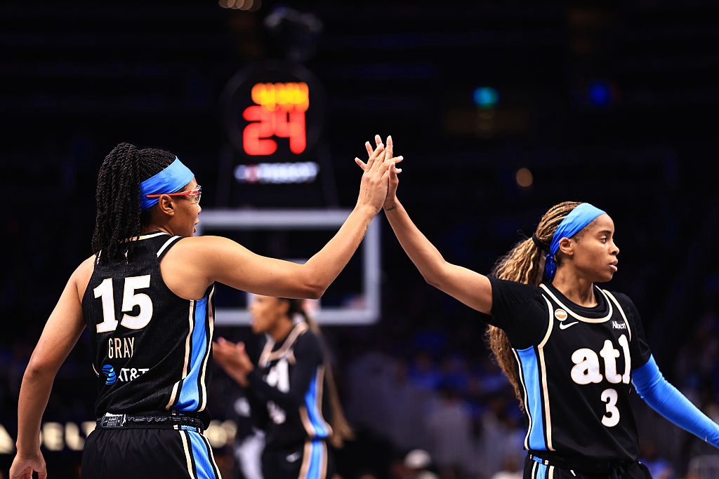 Allisha Gray #15 and Jordin Canada #3 of the Atlanta Dream high five during the game against the Washington Mystics during Round One Game One of the 2026 WNBA Playoffs on September 27, 2026 at State Farm Arena.