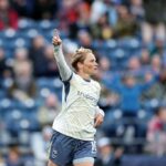 Jess Fishlock #10 of Seattle Reign FC celebrates scoring her team's first goal during the NWSL match between Seattle Reign and Boston Legacy FC at Lumen Field on September 25, 2026.