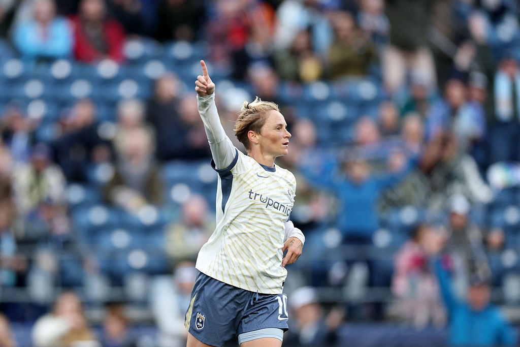 Jess Fishlock #10 of Seattle Reign FC celebrates scoring her team's first goal during the NWSL match between Seattle Reign and Boston Legacy FC at Lumen Field on September 25, 2026.