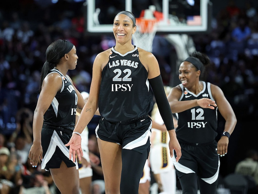 Jackie Young #0, A'ja Wilson #22 and Chelsea Gray #12 of the Las Vegas Aces react after a timeout was called in the fourth quarter of Game One of the 2026 WNBA Playoffs first round against the Indiana Fever.