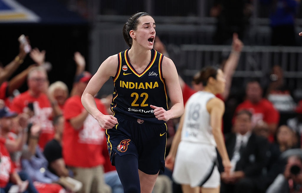 Caitlin Clark #22 of the Indiana Fever celebrates after making a shot in the 99-89 over the Las Vegas Aces during game two of the first round of the WNBA Playoffs at Gainbridge Fieldhouse.