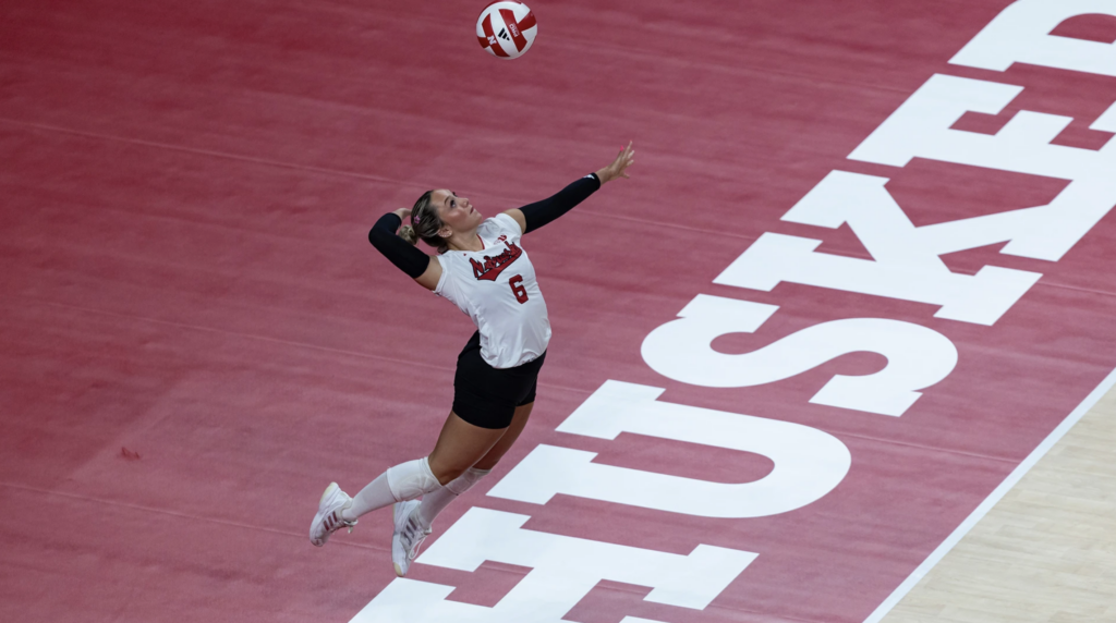 Nebraska volleyball player serves against Creighton at Pinnacle Bank Arena.