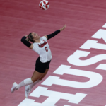 Nebraska volleyball player serves against Creighton at Pinnacle Bank Arena.