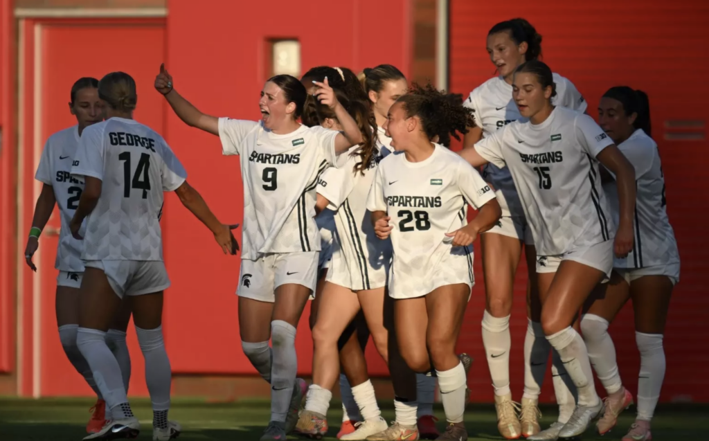 Michigan State's women's soccer team celebrates win.