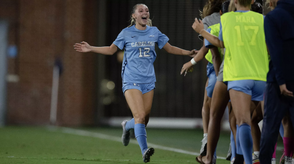 Lilliah Blum celebrates a North Carolina goal with her UNC teammates.