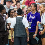 Sep 19, 2026; Columbia, South Carolina, USA; South Carolina Gamecocks women's basketball recruits, from left, GG Banks, Taylor Brown, Jordyn Palmer, and freshman Jerzy Robinson speak with head coach Dawn Staley, back to camera, on the sideline before the football game against the Mississippi State Bulldogs at Williams-Brice Stadium.