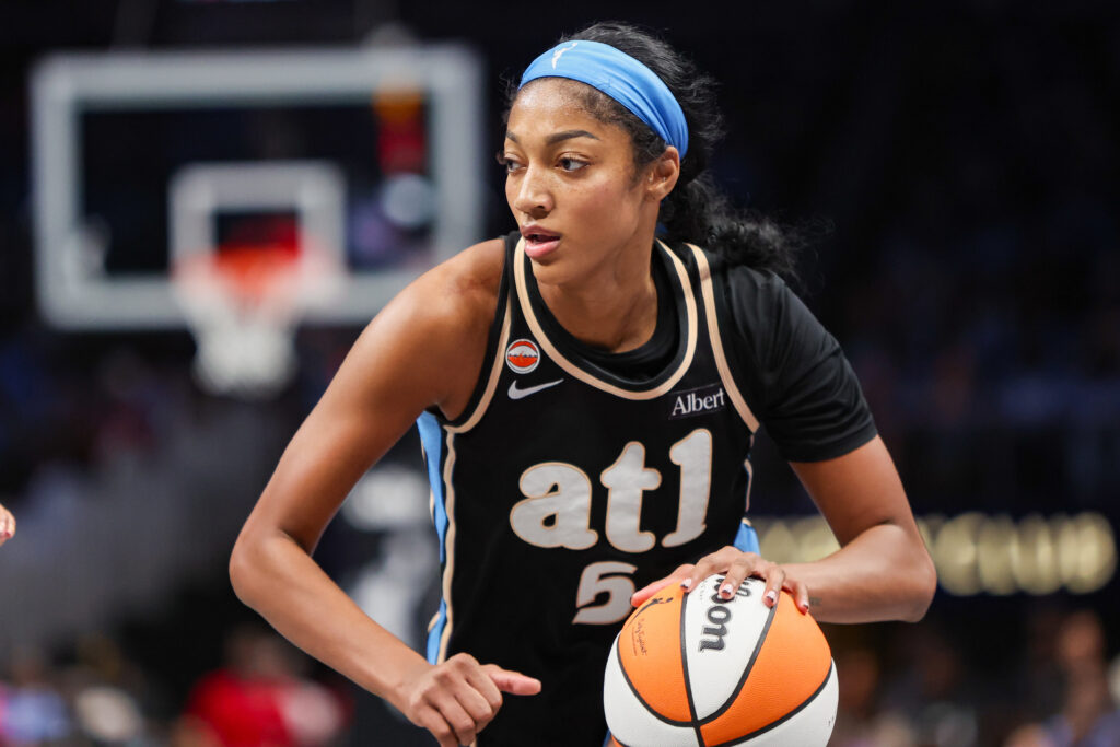 Atlanta Dream forward Angel Reese (5) drives to the basket against the Washington Mystics in the third quarter during game one of the first round for the 2026 WNBA Playoffs at State Farm Arena.