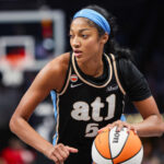 Atlanta Dream forward Angel Reese (5) drives to the basket against the Washington Mystics in the third quarter during game one of the first round for the 2026 WNBA Playoffs at State Farm Arena.