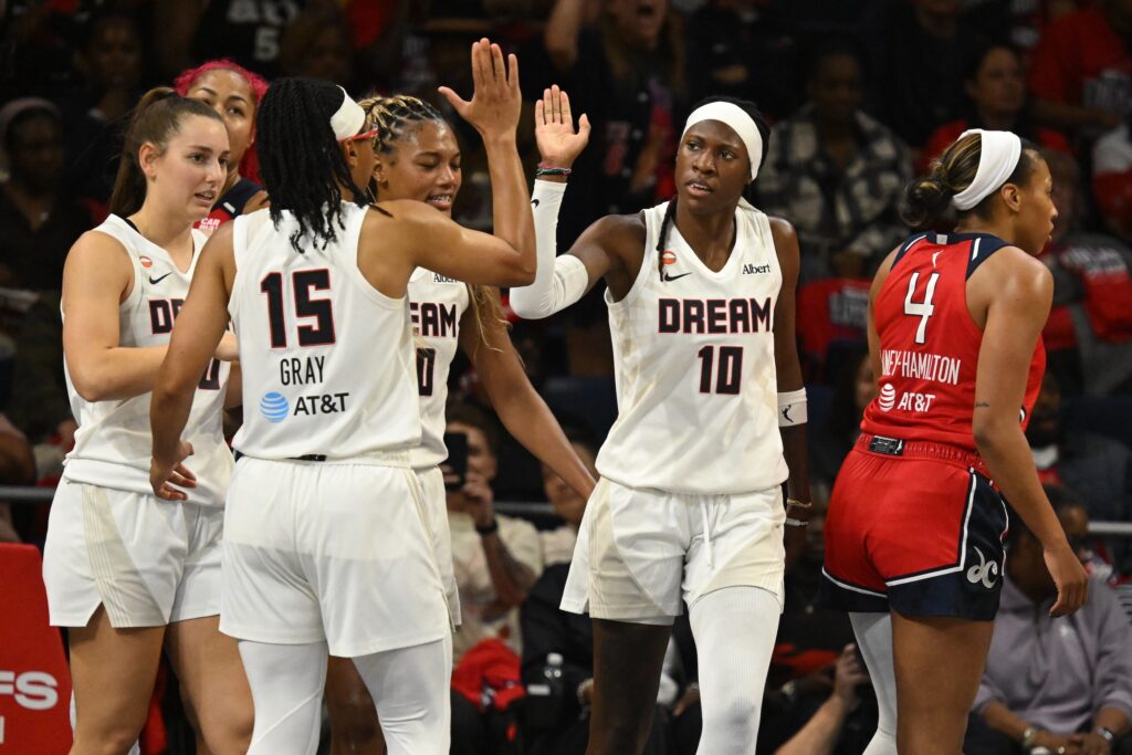 Atlanta Dream guard Rhyne Howard (10) celebrates a play with guard Allisha Gray (15) against the Washington Mystics during the third quarter of game two of the first round for the 2026 WNBA Playoffs at CareFirst Arena.