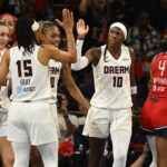 Atlanta Dream guard Rhyne Howard (10) celebrates a play with guard Allisha Gray (15) against the Washington Mystics during the third quarter of game two of the first round for the 2026 WNBA Playoffs at CareFirst Arena.