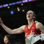Indiana Fever guard Caitlin Clark (22) walks off the court bleeding during the fourth quarter of game three of the first round for the 2026 WNBA Playoffs against the Las Vegas Aces at Michelob Ultra Arena.