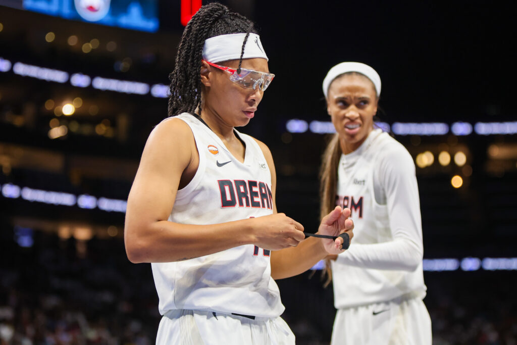 Atlanta Dream guard Allisha Gray (15) adjusts the tap on her fingers against the New York Liberty in the second quarter during game one of the second round for the 2026 WNBA Playoffs at State Farm Arena.