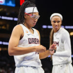 Atlanta Dream guard Allisha Gray (15) adjusts the tap on her fingers against the New York Liberty in the second quarter during game one of the second round for the 2026 WNBA Playoffs at State Farm Arena.