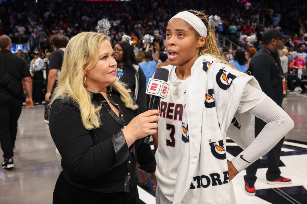 ESPN sideline reporter Holly Rowe talks to Atlanta Dream guard Jordin Canada (3) after a victory over the New York Liberty in game one of the second round for the 2026 WNBA Playoffs at State Farm Arena.