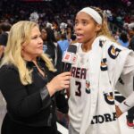 ESPN sideline reporter Holly Rowe talks to Atlanta Dream guard Jordin Canada (3) after a victory over the New York Liberty in game one of the second round for the 2026 WNBA Playoffs at State Farm Arena.