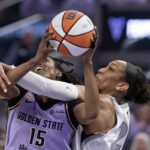 Las Vegas Aces center A'ja Wilson (22) fouls Golden State Valkyries guard Tiffany Hayes (15) as she drives to the basket during the second quarter of game one of the second round for the 2026 WNBA Playoffs at Chase Center.