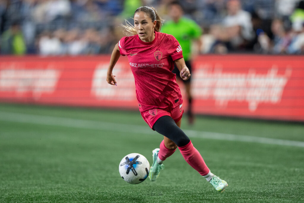 North Carolina Courage midfielder Ashley Sanchez (2) dribbles the ball against the Seattle Reign at Lumen Field.