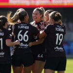 Portland Thorns midfielder Morgan Weaver (22) celebrates with forward Reilyn Turner (66) and the team after scoring a goal in the first half at PayPal Park.