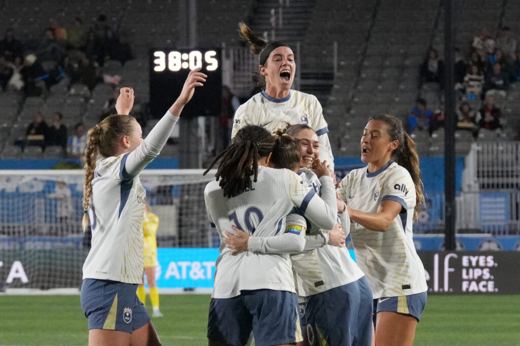 The Seattle Reign FC celebrates midfielder Maddie Mercado (2) goal against the Chicago Stars FC during the first half at Northwestern Medicine Field at Martin Stadium.